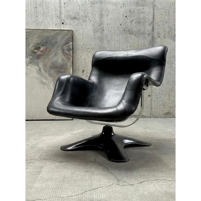 Perhaps one of the most fascinating and our favorite chairs is the "Karuselli" swivel chair with a lacquered fiberglass...