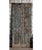 A striking antique Indian carved wood door panel, adorned with an intricate blue floral motif that brings timeless...