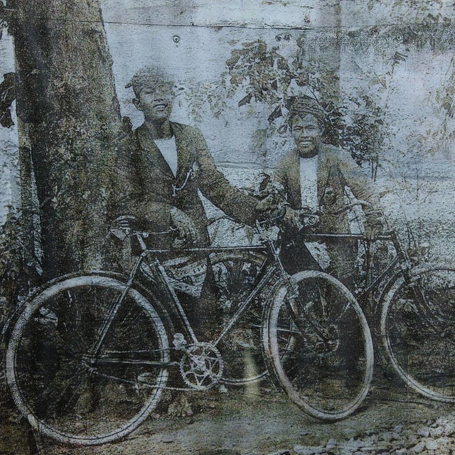 A vintage image of Indonesian people, framed.
