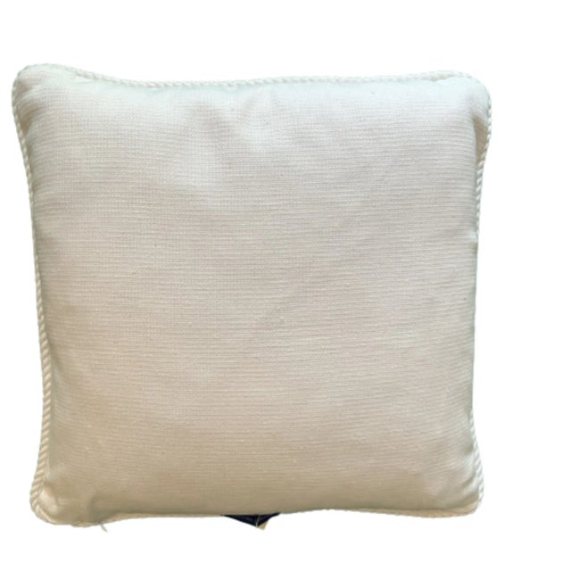 A vibrant hand block print from John Robshaw illustrates small white abstract medallions zooming about the fabric,...