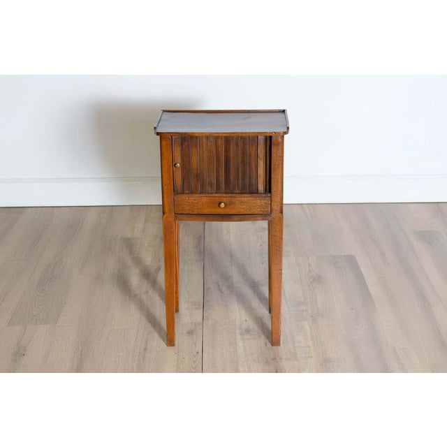 This early 20th-century Italian chevet table, circa 1900, is a charming example of functional elegance. Crafted from...