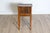 This early 20th-century Italian chevet table, circa 1900, is a charming example of functional elegance. Crafted from...