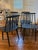 A handsome set of four vintage Danish Modern spindle-back dining chairs manufactured by FDB Møbler of Denmark. Each chair...