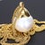 This long 18k yellow gold necklace is where the stunning 16.5mm pearl hanging from it calls home. A simple design to...