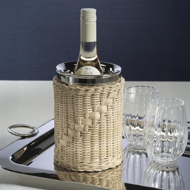 Designed to snugly hold a wine bottle, this woven rattan cane wine cooler offers an effortlessly stylish way to keep your...