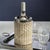 Designed to snugly hold a wine bottle, this woven rattan cane wine cooler offers an effortlessly stylish way to keep your...