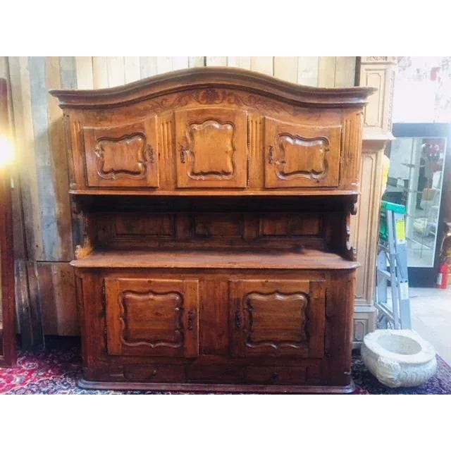18th century European cupboard. Features 3 doors at top plenty of storage, and bottom with tow doors storage.