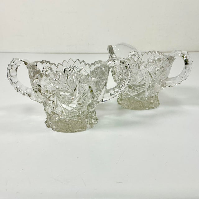 Between 1876 to 1916 American glass producers hand cut glass with sawtooth edging that became known as American Brilliant...