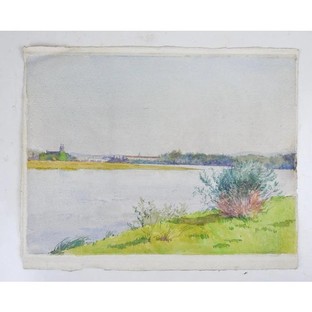 Late 20th century french watercolor painting on handmade wove paper of riverside landscape. Unsigned, detailed and...