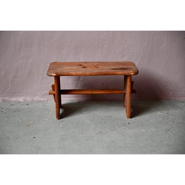 Simple yet charming, this small plant stand or side stool is crafted from solid wood. Designed to hold a plant or...