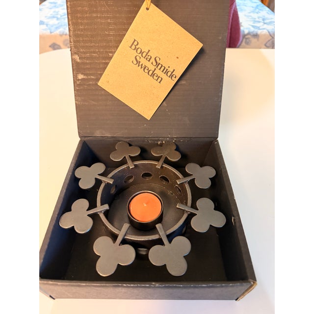 Elevate your Scandinavian decor with this authentic 1970s hand-forged wrought iron "clover" teapot and dish warmer....