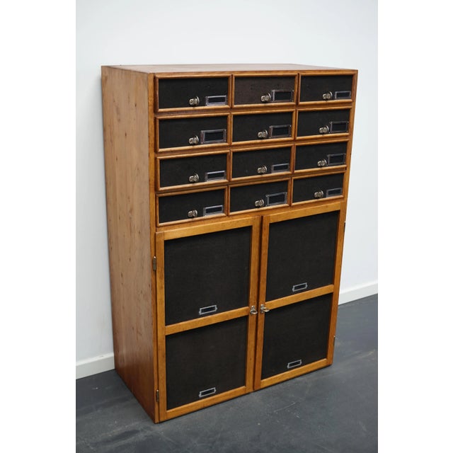 This apothecary cabinet was made circa 1940s in Germany and was later used in a hardware store in Belgium until recently....