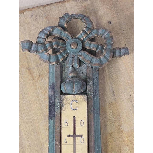 18th/19th Century Lacquered Gilt Wood Thermometer. Louis XVI/Directoire style. Decorated with knotwork. The wood is...