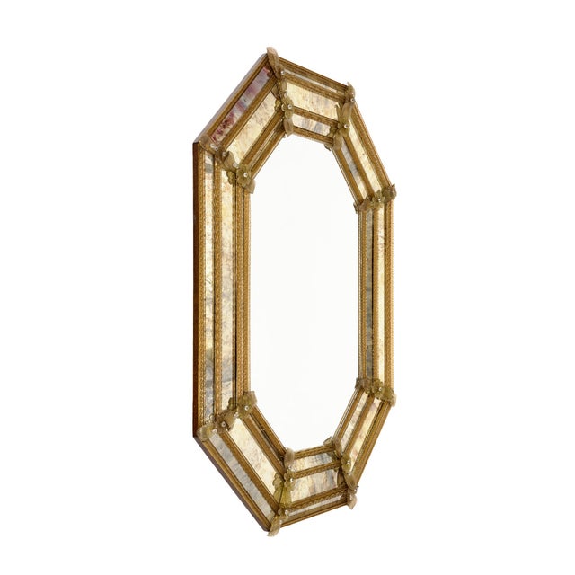 Mirror from Venice, Italy made with hand made glass flowers and trim throughout. The parclose octagonal design is a...