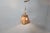 Vintage brutalist hammered copper sheet pendant light. The lamp emits a nice diffuse light thanks to the perforated shade....