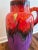 A 1970s West German 'Fat Lava' vase by Scheurich Keramik. Glazed with a vibrant red-orange and purple. The vase is marked...