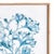 As elegant in style as it is in scale, this serene monochromatic blue coral framed print is signature upscale coastal...