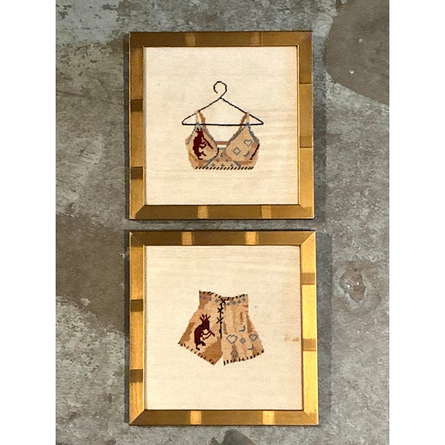 This charming pair of original vintage needlepoint artworks is a masterclass in the "Grandmillennial" aesthetic, artfully...