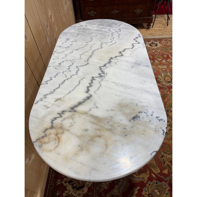 Authentic classic bistro table dating from the early 20th century. This piece combines the timeless elegance of veined...