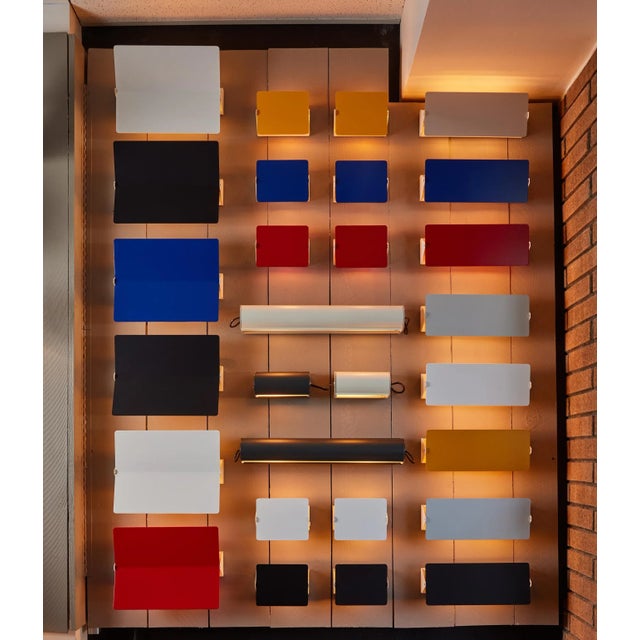 Charlotte Perriand 'Applique À Volet Pivotant Double' wall light in aluminum. A clean and iconic design executed in...