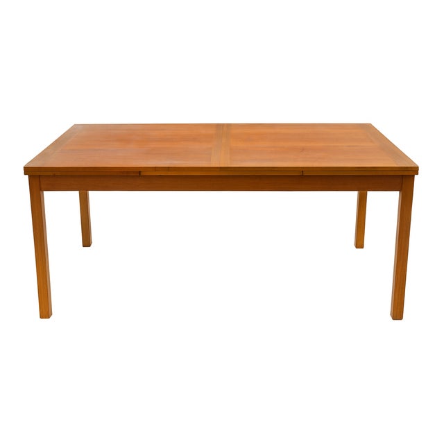 Description: Bring home a true piece of mid-century craftsmanship. This vintage Danish Modern teak dining table features...