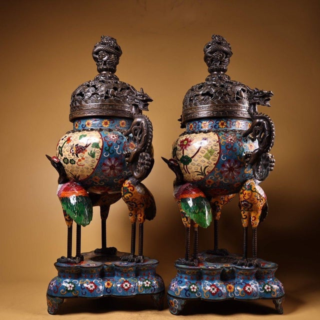 This exceptional pair of incense burners is masterfully crafted from gilt bronze and richly decorated with cloisonné...