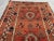 Antique Afghan Baluchi Rug With Geometric Tribal Medallion Design in Terracotta and Navy Rug For Sale - Image 4 of 11