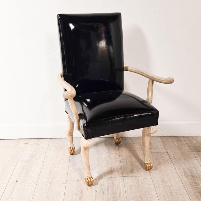 A pair of bespoke John Dickinson Etruscan armchairs upholstered in patent leather, circa 1980. Seat height 21". Five pairs...