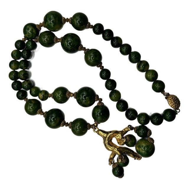 1950s Bakelite Pendant Necklace With Green and Yellow Marbled Beads and a Gold Tone Monkey Pendent Holding Beads Excellent Pre Owned Condition For Sale