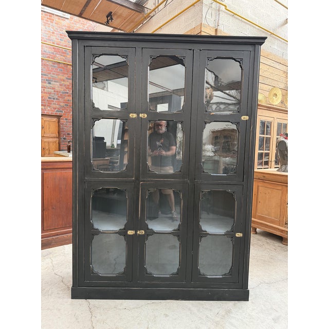 This antique museum display case has been fully restored. It features six glass doors that close with brass latches and...