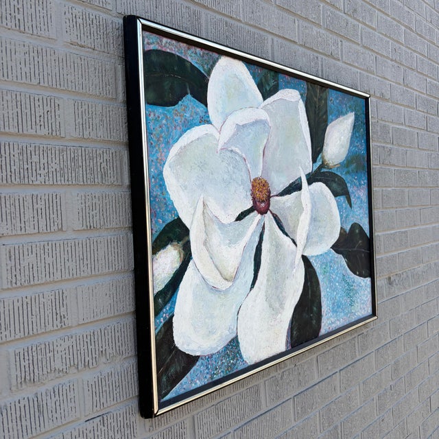 A striking original floral painting by American artist Norma Wood, featuring an oversized magnolia blossom rendered in...