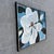 A striking original floral painting by American artist Norma Wood, featuring an oversized magnolia blossom rendered in...