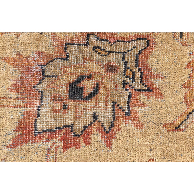 This circa-1920 antique Sultanabad rug features an all-over design of multicolored arabesques, floral abstractions and...