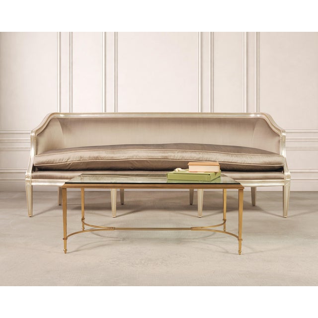 An elegant 20th century Neoclassical French bronze metal cocktail or coffee table featuring a fine polished finish....