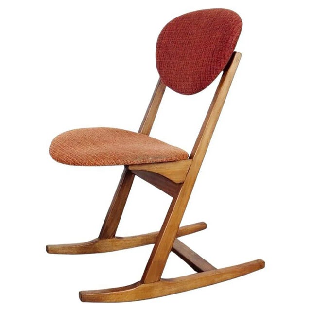 Czechoslovakian Mid-Century Modern rocking chairs, from the 1970s. The 4 pieces have a neat wooden architecture and are...