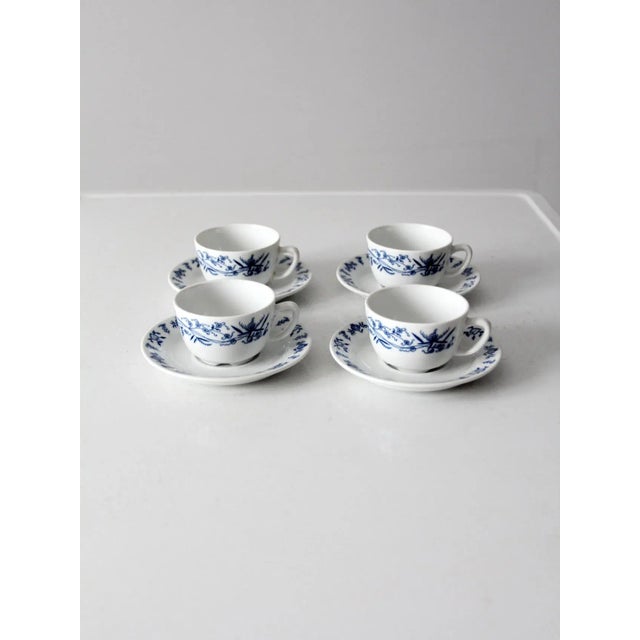 This is a collection of four vintage Porsgrund Varefakta tea cup and saucer sets circa 1970s. The white porcelain dishes...