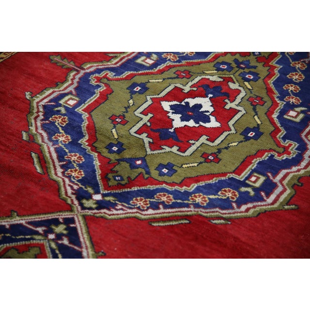 Introducing a one-of-a-kind vintage Turkish hand-knotted wool rug, carefully crafted by skilled artisans using traditional...