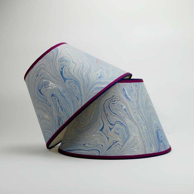 Marbled paper with blue, silver and red; trimmed in two colors of grosgrain. Available in 3 sizes: 8” x 12” x 8.75” 9” x...