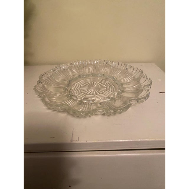 A timeless entertaining piece with quiet elegance, this vintage pressed glass egg plate brings a refined, coastal charm to...