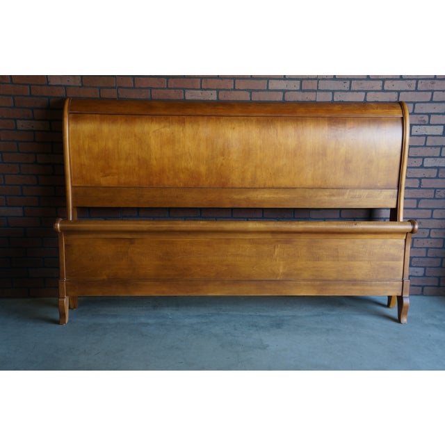 A modern take on a traditional sleigh bed. This king size Chloe bed was finely crafted by Ethan Allen in Vermont. The...