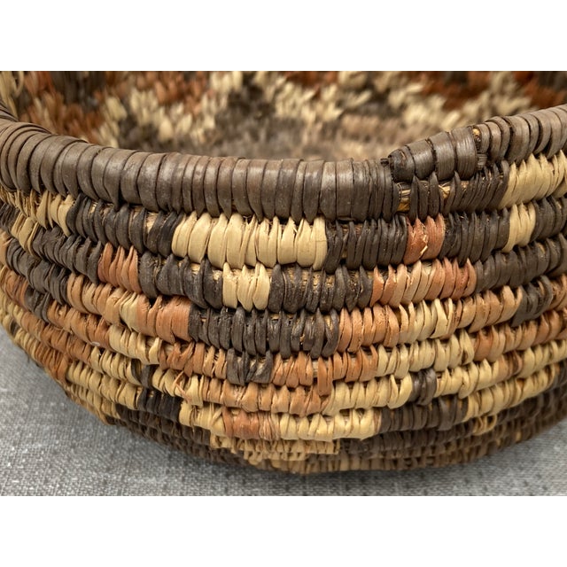 Small vintage Native American coil basket. Basket measures 6 1/4" in diameter by 3" in height. Great condition. Thank you...