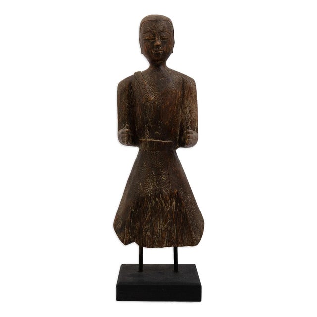This carved female tribal sculpture brings an earthy, artisan crafted presence to any setting. Fashioned from solid wood,...