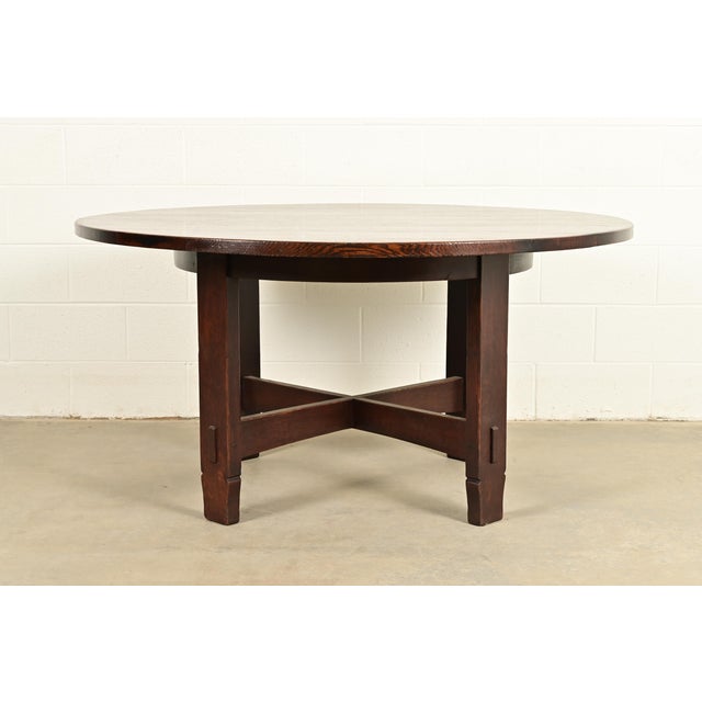 A rare and exceptional antique Mission or Arts & Crafts period quarter sawn oak round dining table or center table By...