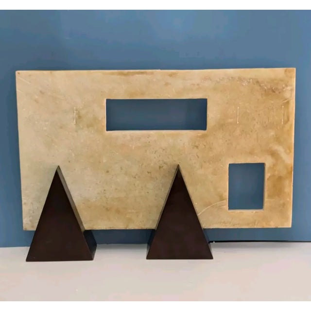Sleek modern art rectangular bisque and tan colored marble with cut out rectangle and square. Marble is 9.5 inches high x...