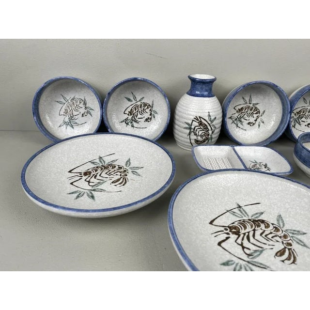 Nice Japanese set consisting of 3 large plates, 5 bowls, sake jar and ginger/soya dish. New old stock. Dimensions: -board:...