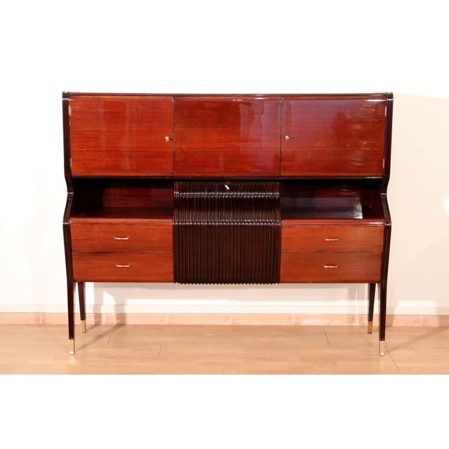 Mid-Century Sideboard in Mahogany, Rosewood and Maple by Osvaldo Borsani, Italy, 1950s, in Very Good conditions. Designed...