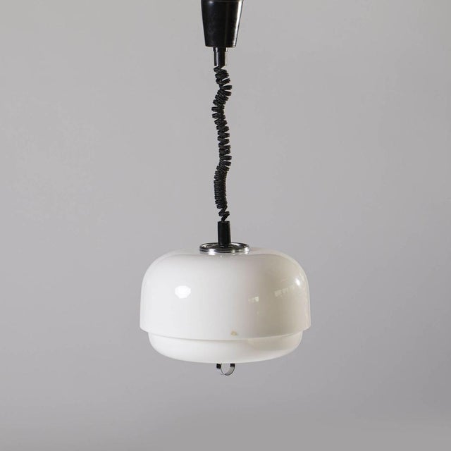 Space Age adjustable pendant lamp produced by Meblo / Guzzini, italy, 1970s. Made of white / white plastic with chromed...