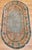 A truly rare and beautiful Art Deco Chinese area rug from the early 1900s in an unusual oval shape — a format always made...