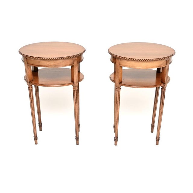 An exceptional pair of antique Edwardian solid walnut side tables. They were made in England, they date from around the...