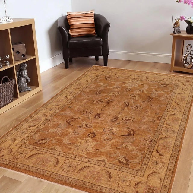 Mesmerizing intricacy and a gorgeous color palette, this hand-knotted masterpiece is a semi-Vintage distressed vintage...